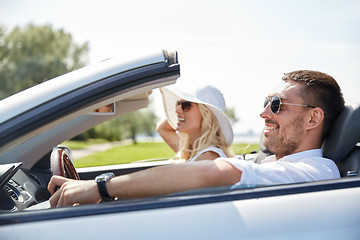 Image showing happy man and woman driving in cabriolet car