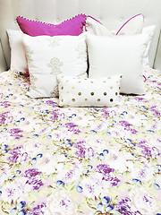 Image showing White and purple bed linen with floral design