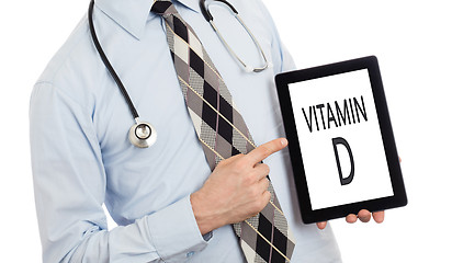 Image showing Doctor holding tablet - Vitamin D