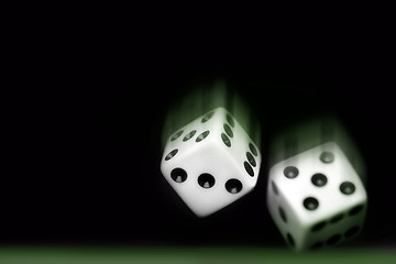 Image showing Rolling Two dices on black background