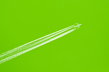 Image showing Plane in blue sky - Bright green sky