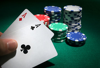 Image showing Looking at pocket aces during a poker game.