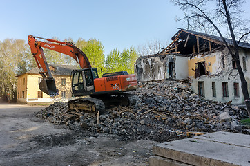 Image showing Digger demolishing houses for reconstruction