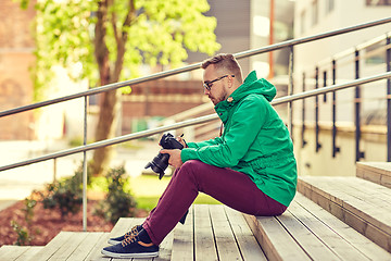 Image showing young hipster man with digital camera in city