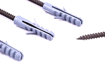 Image showing Three hunting screws in a row