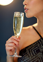 Image showing close up of woman drinking champagne at party