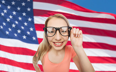 Image showing happy young woman or teenage girl in eyeglasses