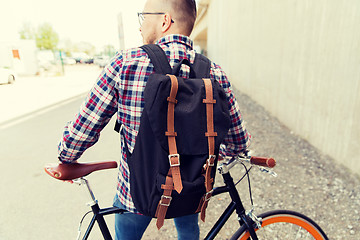 Image showing hipster man with fixed gear bike and backpack