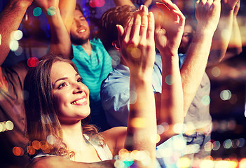 Image showing smiling friends at concert in club