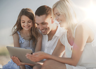 Image showing happy family with tablet pc taking picture