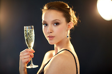 Image showing young asian woman drinking champagne at party
