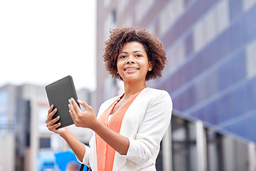 Image showing happy african businesswoman with tablet pc in city