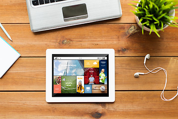 Image showing close up of tablet pc computer on wooden table