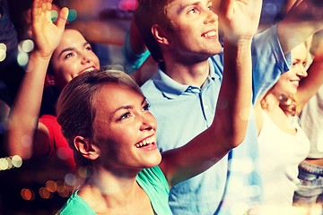 Image showing smiling friends at concert in club