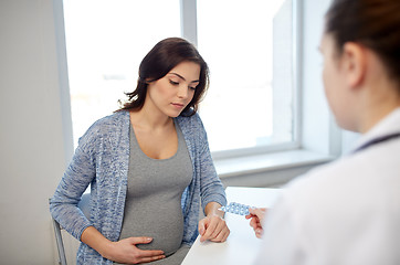 Image showing gynecologist doctor and pregnant woman at hospital