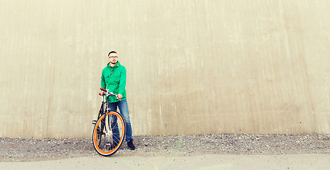 Image showing happy young hipster man with fixed gear bike