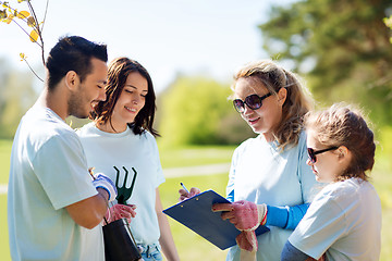 Image showing group of volunteers planting trees in park