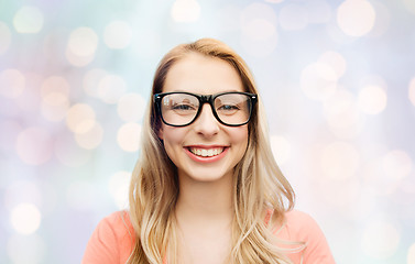 Image showing happy young woman or teenage girl in eyeglasses