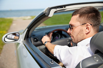 Image showing happy man driving cabriolet car outdoors