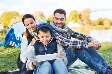 Image showing happy family with tablet pc and tent at camp site