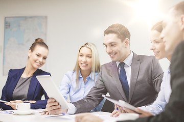 Image showing business team with tablet pc having discussion