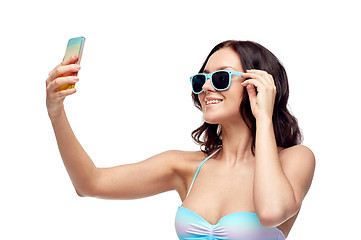 Image showing woman in swimsuit taking selfie with smatphone