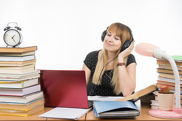 Image showing After hearing the student an interesting music on headphones