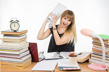 Image showing Student University of fatigue and anger crumpled drawing wanting to hit them on the table