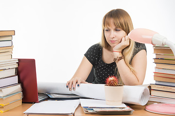 Image showing Student with contempt and weariness looking at laptop monitor