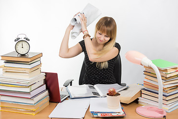 Image showing Student University of fatigue and anger crumpled drawing and beats them in a folder with a diploma