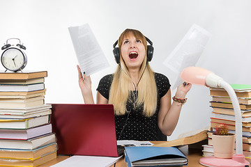 Image showing A student shouts charter understand and read the paper in preparation for the session