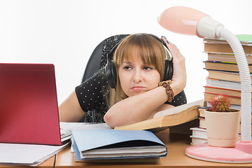 Image showing Student thinking sadly looks at the laptop screen