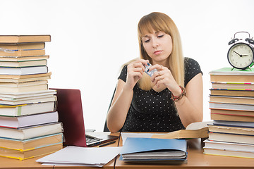 Image showing The student wants to take a pill for a headache