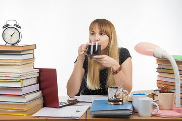 Image showing Student drinking coffee by preparing for the exam at night