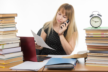 Image showing Teacher discusses by phone written on a sheet of paper