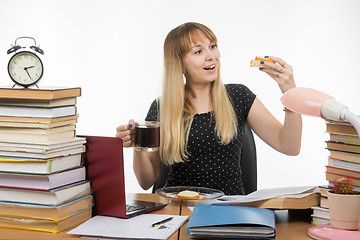 Image showing Hungry young teacher very happy sandwich with coffee