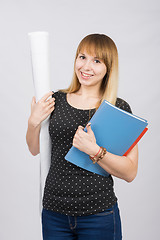 Image showing The joyful girl with a roll of drawings and a folder in hands