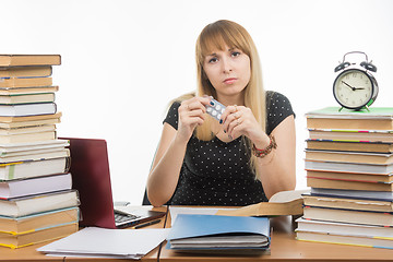 Image showing Diseased student sitting at the table with tablets in hands