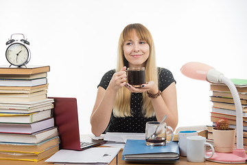 Image showing Student enjoys a glass of coffee at night preparing for exams