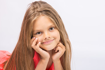 Image showing Portrait of a seven-year cheerful little girl on a white background