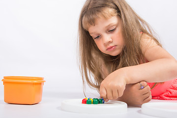 Image showing Concentrated girl collects mosaic