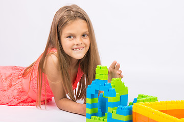 Image showing Seven-year girl builds a house from the block designer