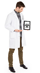 Image showing Doctor holding tablet - Warning! Biohazard!