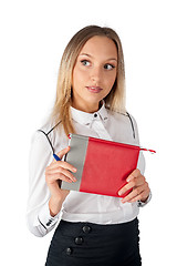 Image showing Pretty businesswoman standing with organizer diary