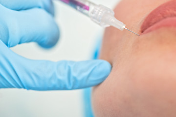 Image showing woman gets injection in her lips