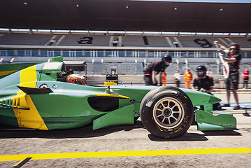 Image showing Race car driver in the pitlane for a pitstop