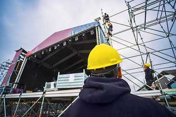 Image showing building entertainment stage for music festival wearing safety c