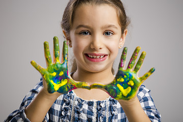 Image showing Little girl with hands in paint