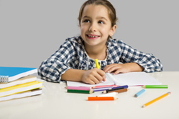 Image showing Little girl making drawings