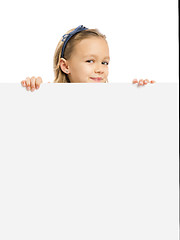 Image showing Cute Girl holding a whiteboard